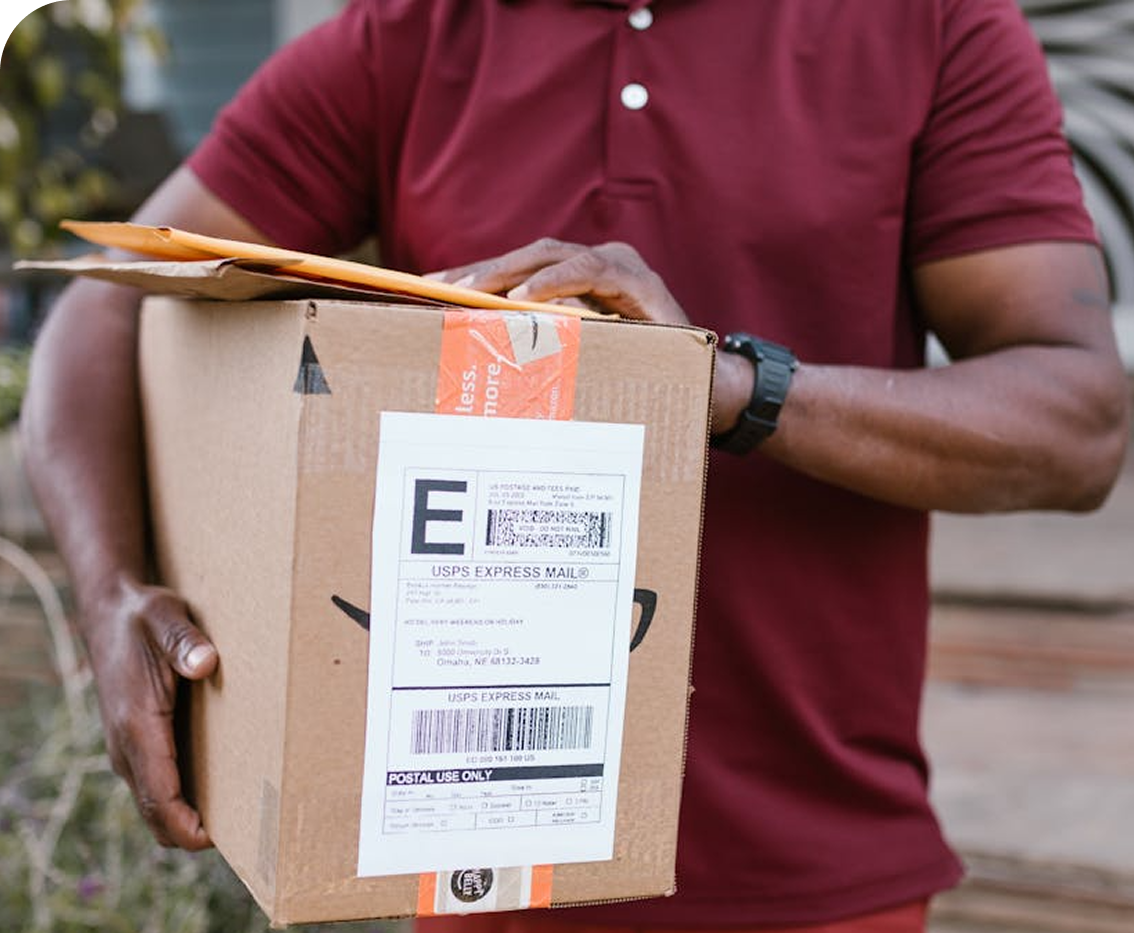 Person holding a package for delivery